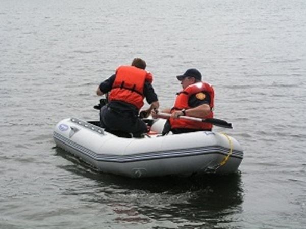Two Fire Fighters on a Raft